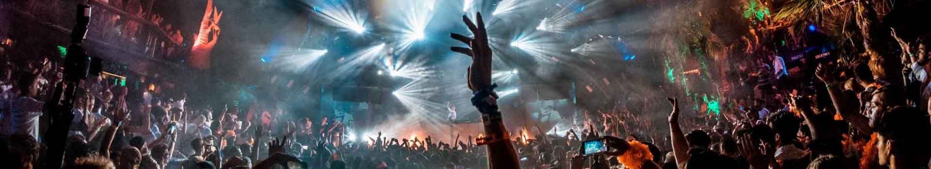 Festival crowd and light show at night on Zrće Beach